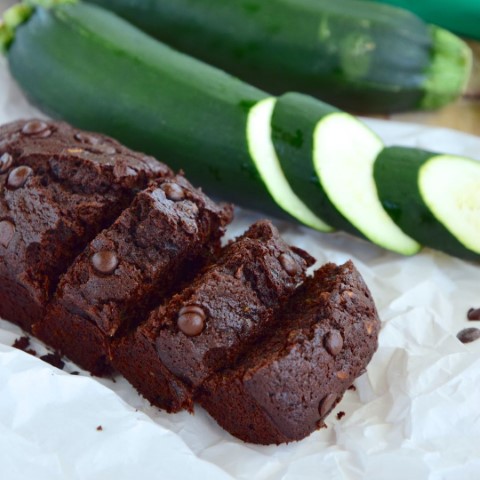 Chocolate zucchini cake recipe ingredients and finished cake featuring fresh local zucchini from The Greensted grocery store in downtown Zumbrota, perfect for summer baking.